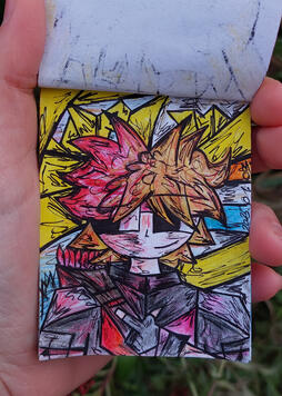 This is a photo of me holding up the drawing of Cuteguy