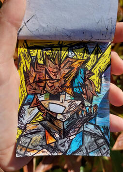 This is a photo of me holding up the drawing of Hotguy