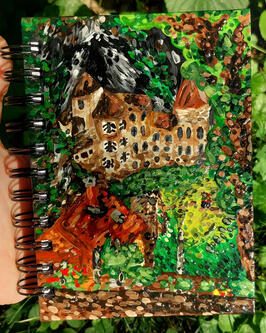 This is a photo of my painted sketchbook that I made last year